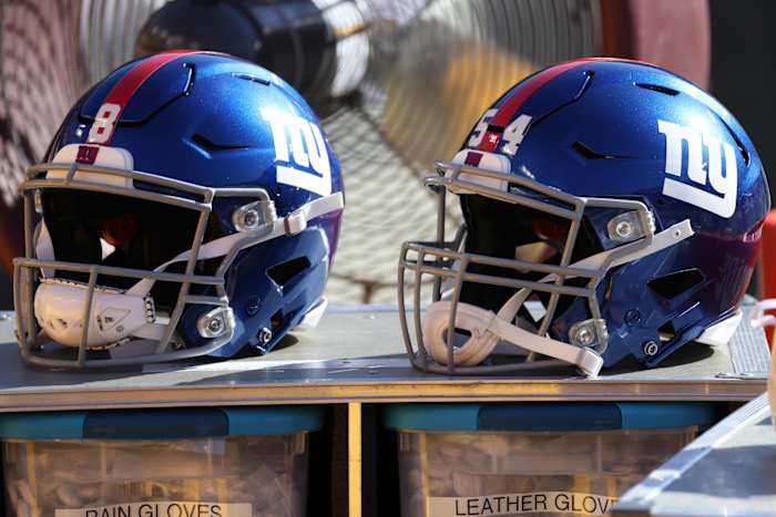 Nov 8, 2020; Landover, Maryland, USA; A view of the helmets of New York Giants quarterback Daniel Jones (8) and Giants inside linebacker Blake Martinez (54) resting on equipment case on the sidelines against the Washington Football Team at FedExField.